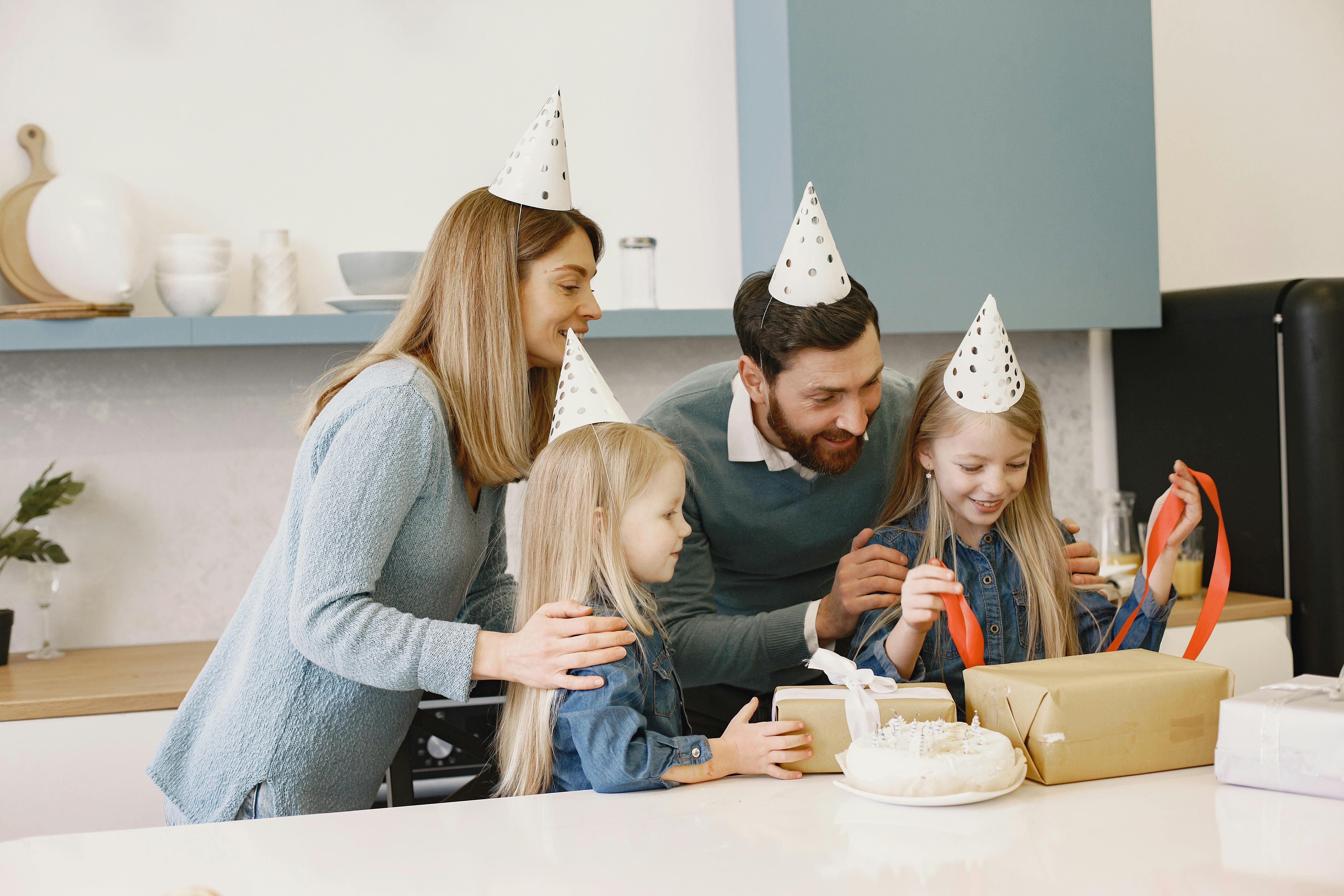Family celebrating as someone opens a gift